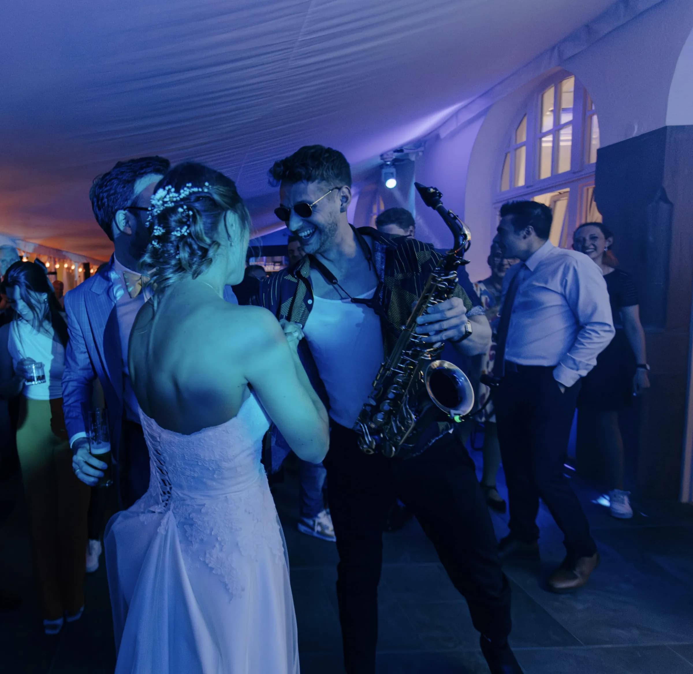 Pascal playing saxophone for the bride on the dance floor
